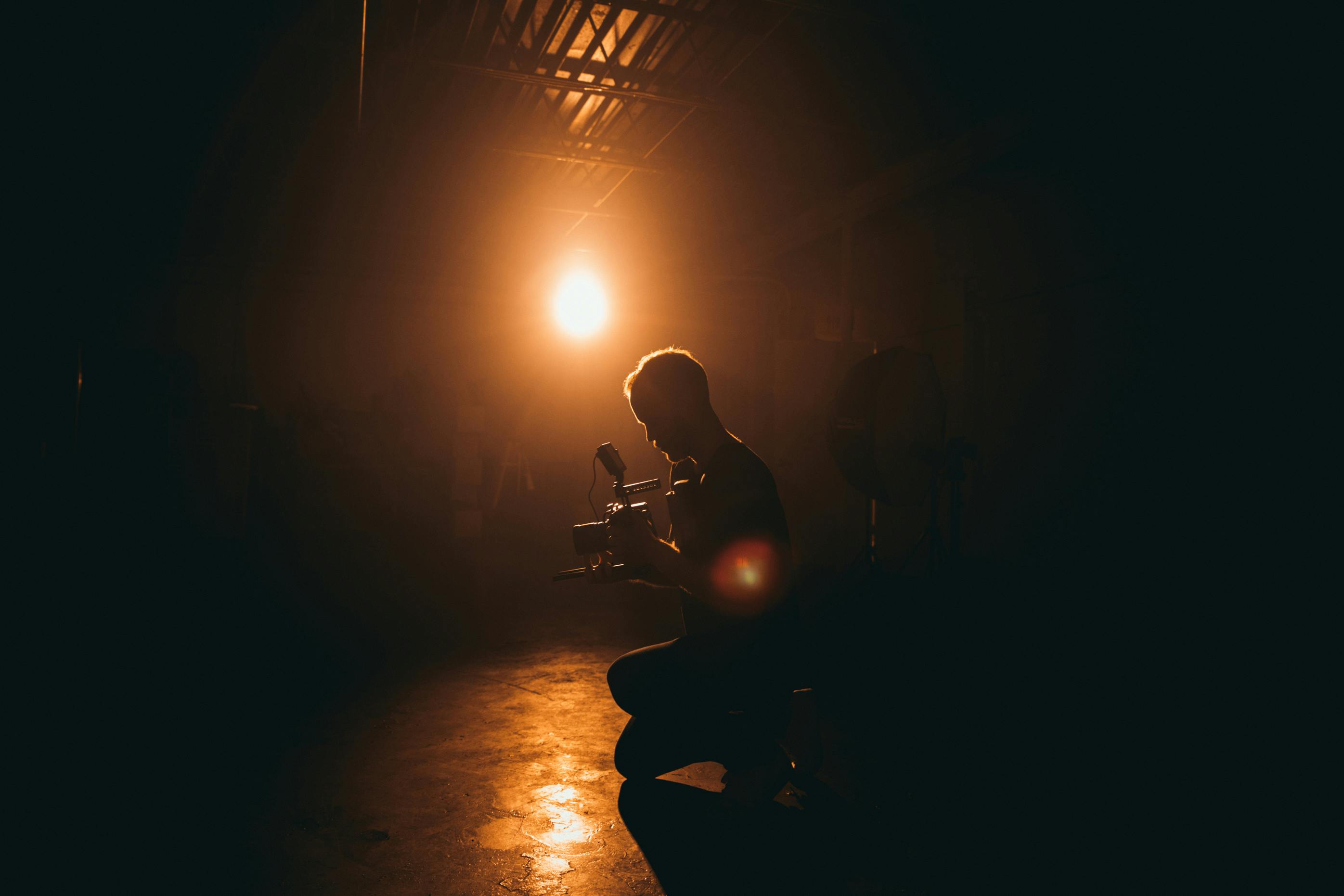 A videographer filming on location